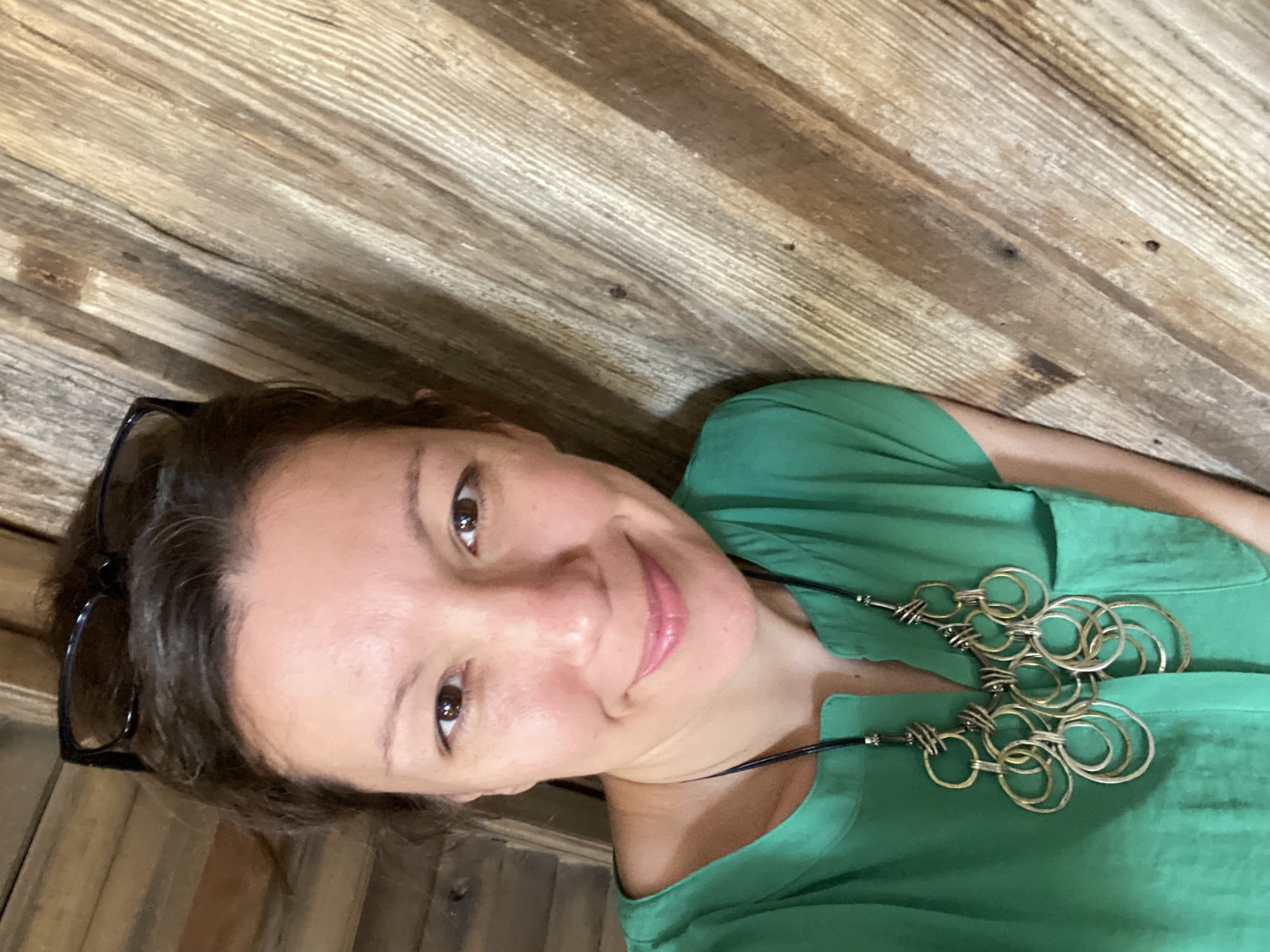 Amanda Herndon, dementia care educator, smiling outdoors
