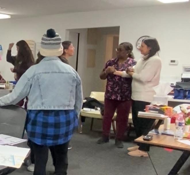 Care teams practicing Hand-under-Hand ® support together