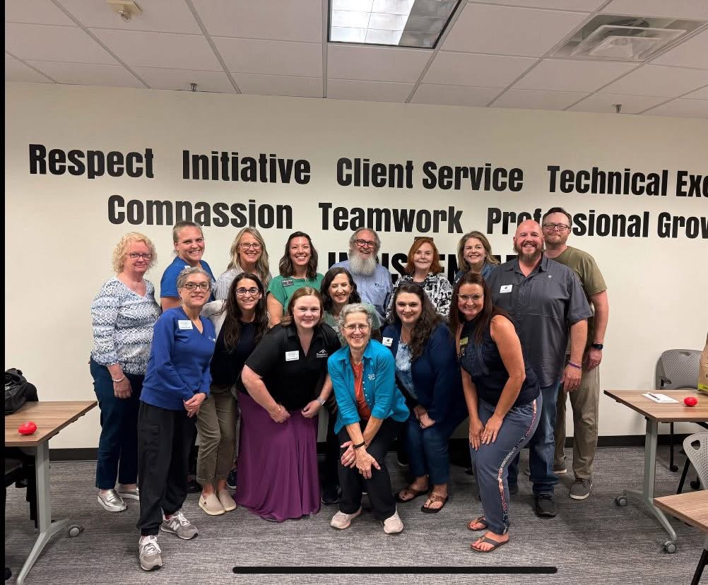A large group of care professionals after PAC training